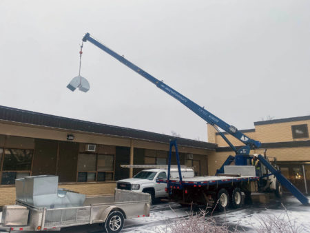 Crane truck rental: roof top unit installation
